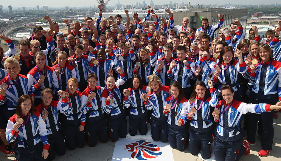 Team GB holding up their medals.